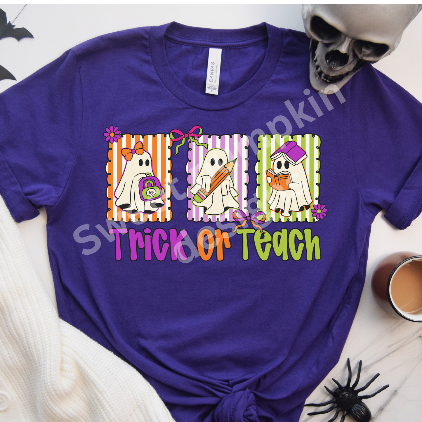 Trick or Teach Halloween teacher shirt with three cute ghosts and bright Halloween colors on Bella + Canvas tee