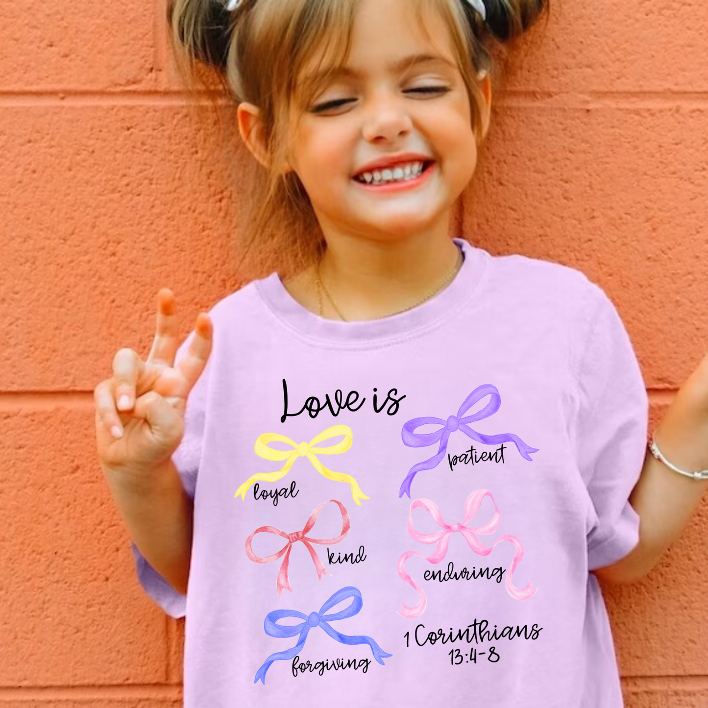 Christian love shirt for girls featuring a cute love design with bows, faith-based youth t-shirt perfect for church, Sunday wear, or Christian gifts for girls
