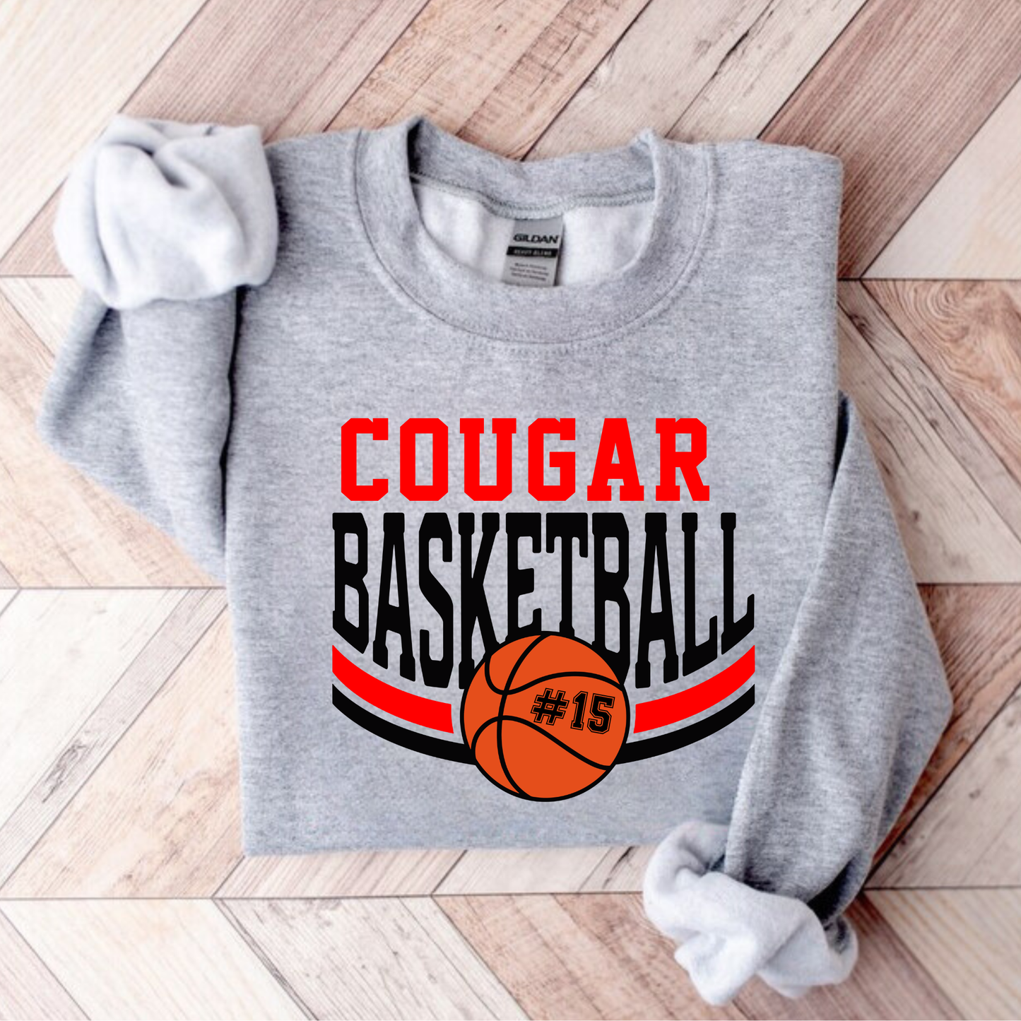 Custom basketball sweatshirt with team name, mascot, and player number on Gildan 18000 crewneck