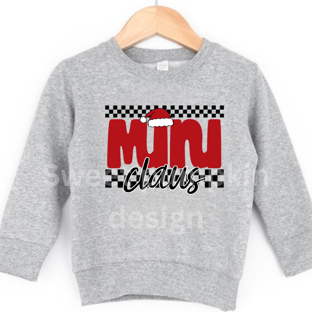 Gray sweatshirt with 'Mini Claus' text and checkered pattern on a hanger