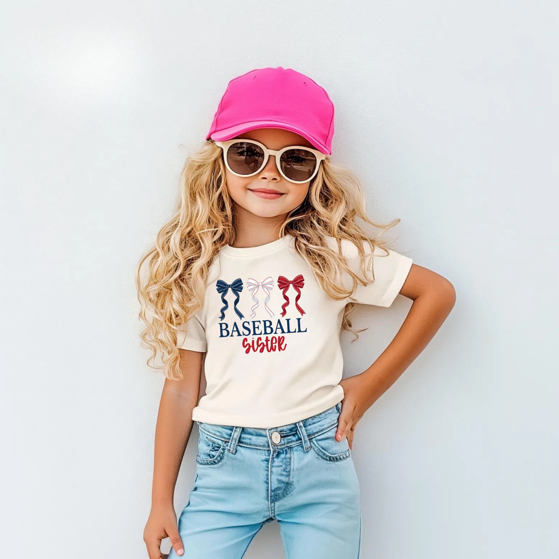 Cute baseball sister bow shirt for girls with soft comfy fit, perfect little sister game day outfit for baseball season