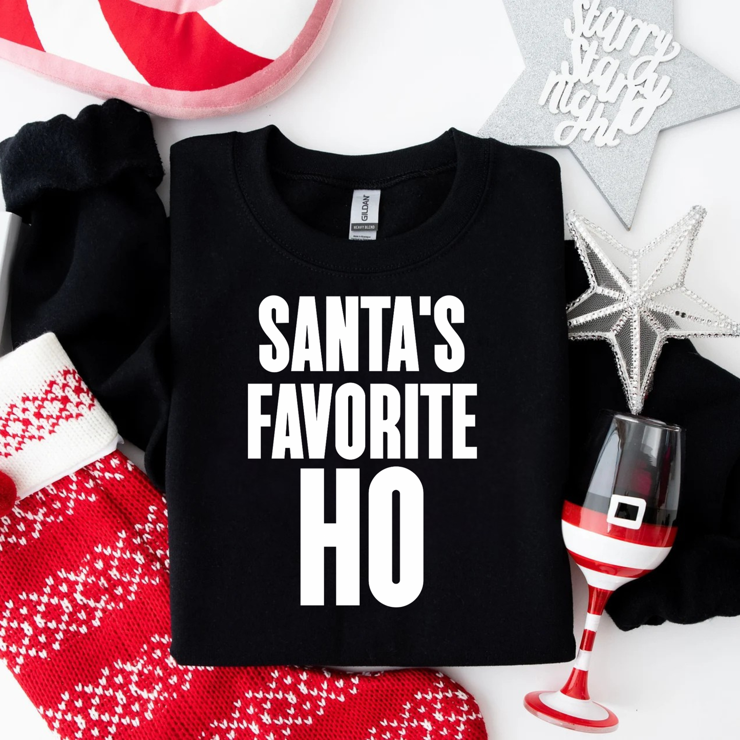 Funny Christmas sweatshirt saying Santa’s Favorite Ho on a Gildan 18000 crewneck