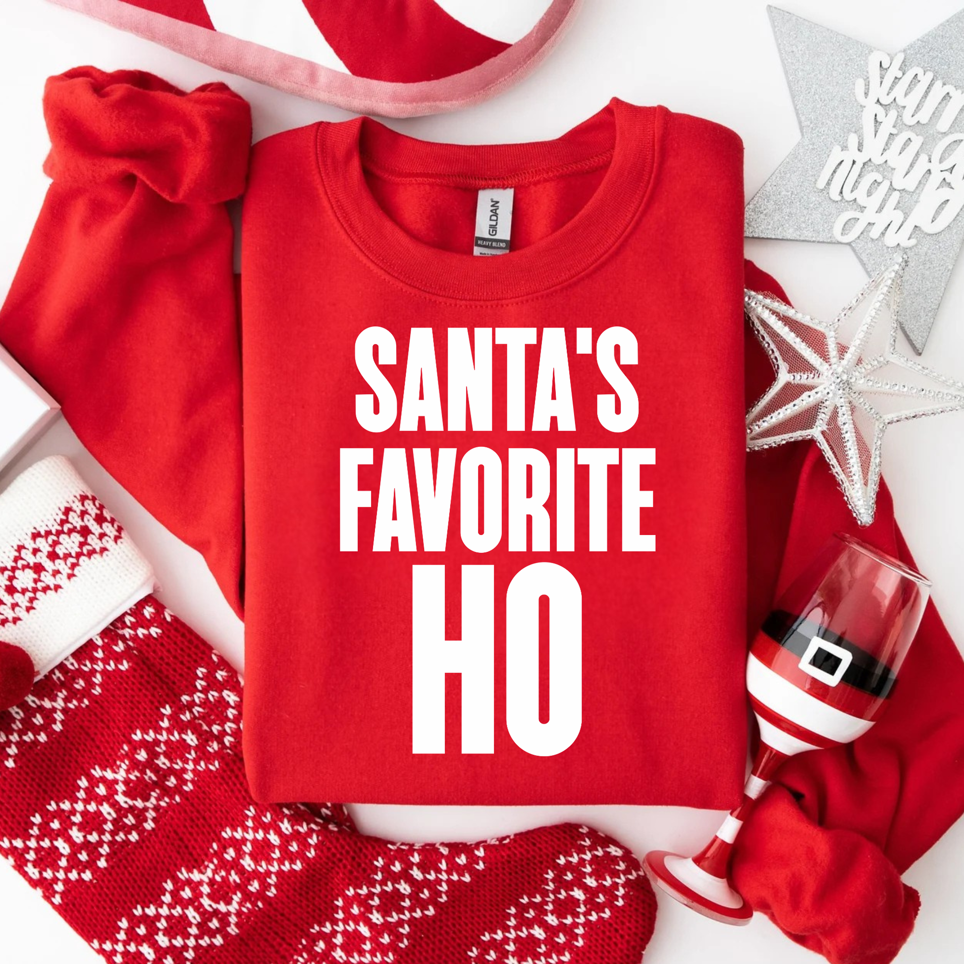 Funny Christmas sweatshirt saying Santa’s Favorite Ho on a Gildan 18000 crewneck