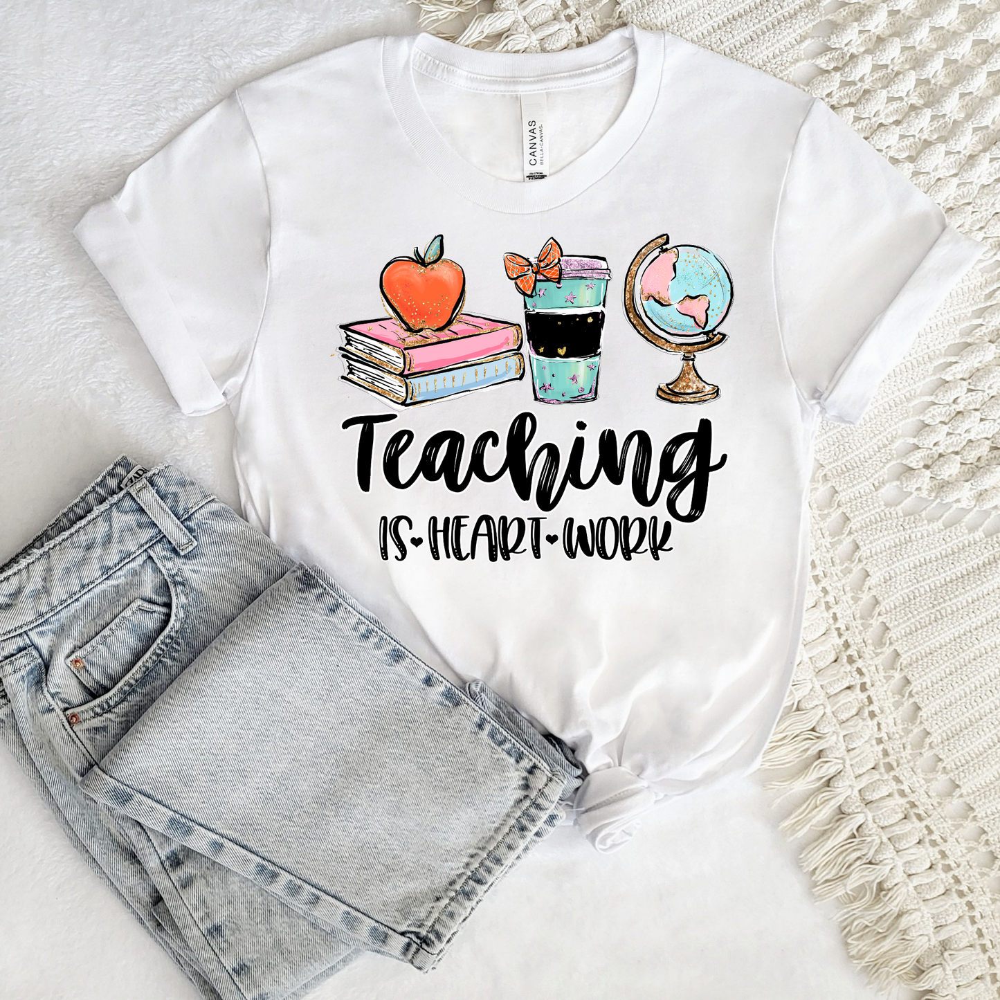 Teacher wearing Teaching Is a Work of Heart shirt in classroom, cute teacher appreciation gift tee perfect for back to school and end of year teacher gift