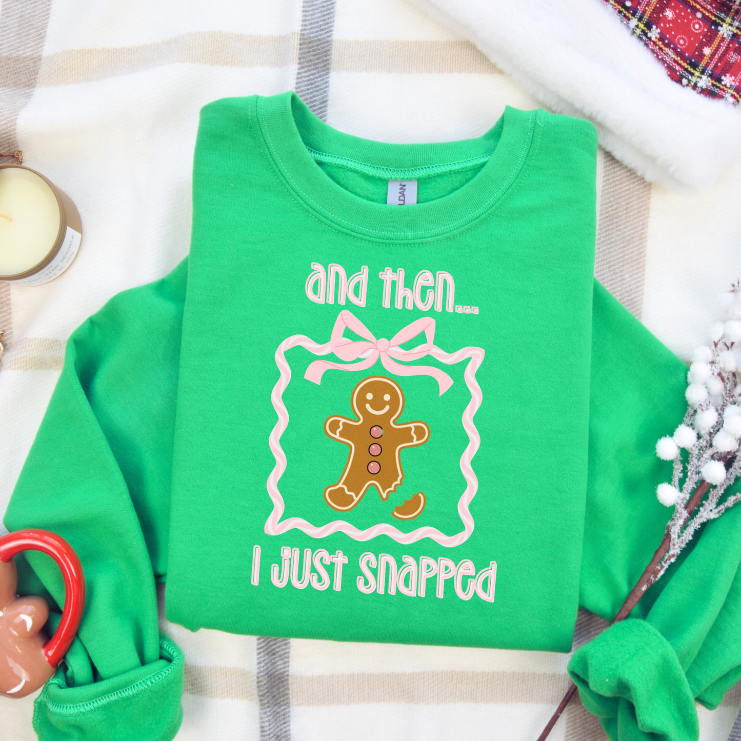 Funny gingerbread Christmas sweatshirt with “and then I just snapped” quote and broken-leg gingerbread graphic, on Gildan 18000 crewneck.