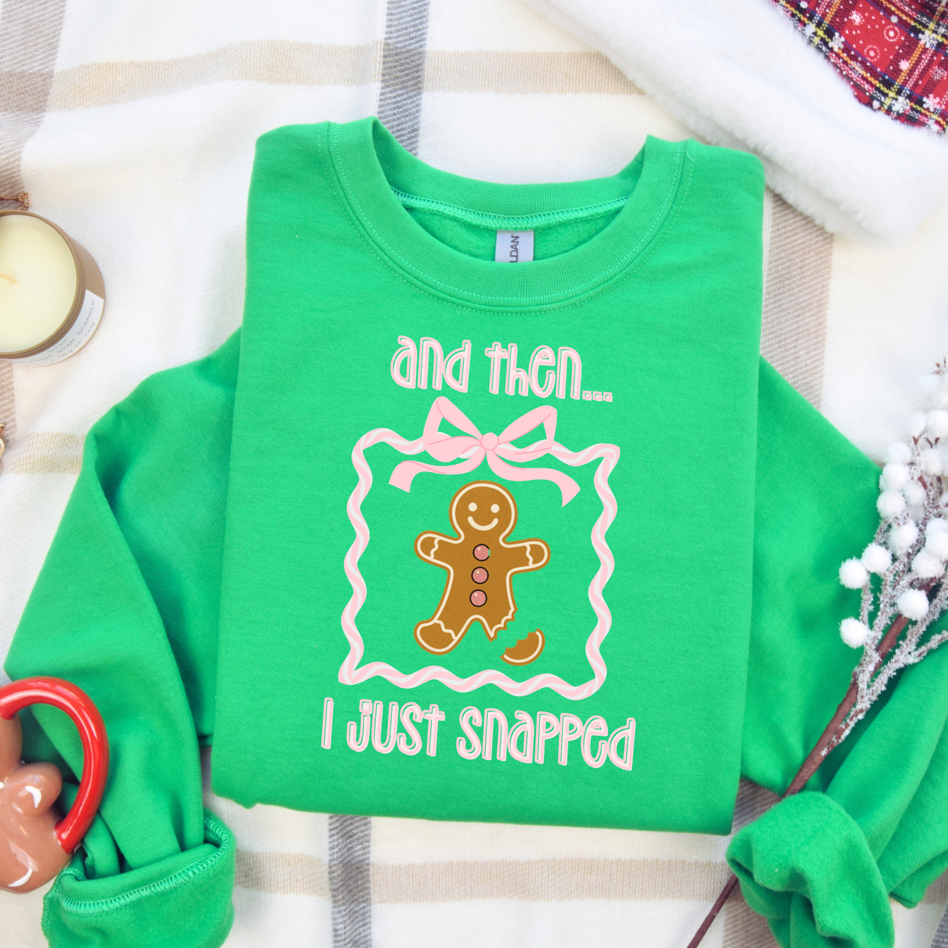 Funny gingerbread Christmas sweatshirt with “and then I just snapped” quote and broken-leg gingerbread graphic, on Gildan 18000 crewneck.