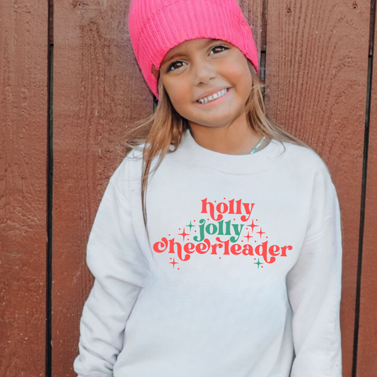 Holly Jolly Cheerleader Christmas sweatshirt on Gildan 18000 crewneck — festive holiday cheer design for girls.
