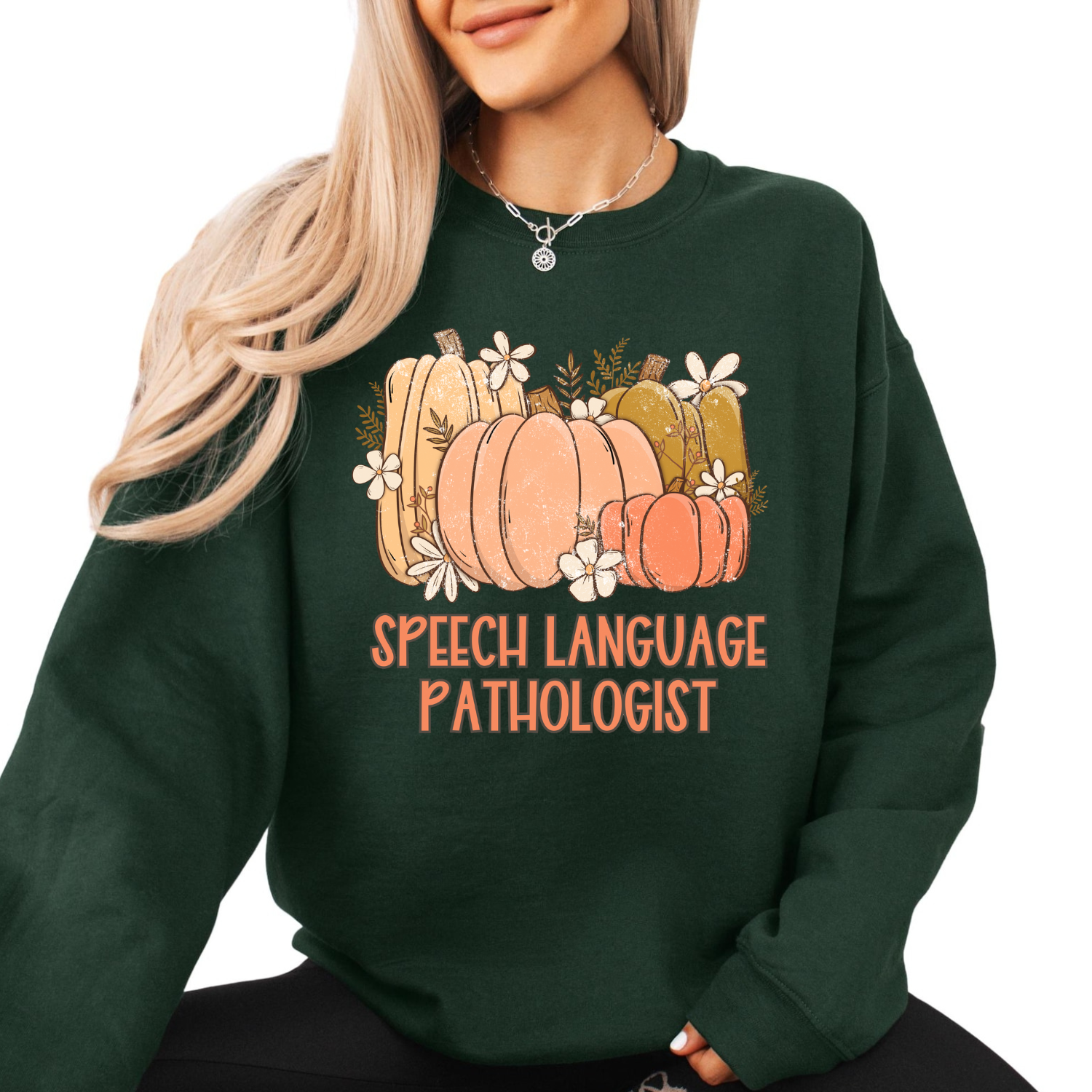 Woman wearing a Speech-Language Pathologist fall pumpkin sweatshirt, cozy Gildan crewneck for speech therapists and teachers, perfect fall outfit