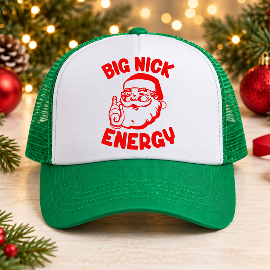 Green and white foam Christmas trucker hat featuring a red vintage Santa graphic and Big Nick Energy lettering, a funny holiday party accessory and white elephant Christmas gift.