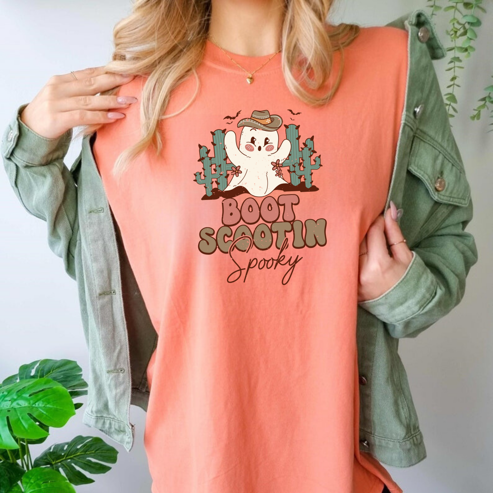 Trendy oversized preppy Western Halloween shirt with "Boot Scootin' Spooky" cowboy design - Embrace the spirit of Western Halloween and autumn with this stylish and playful shirt featuring a ghost cowboy. Perfect blend of retro and trendy fashion for your fall festivities.