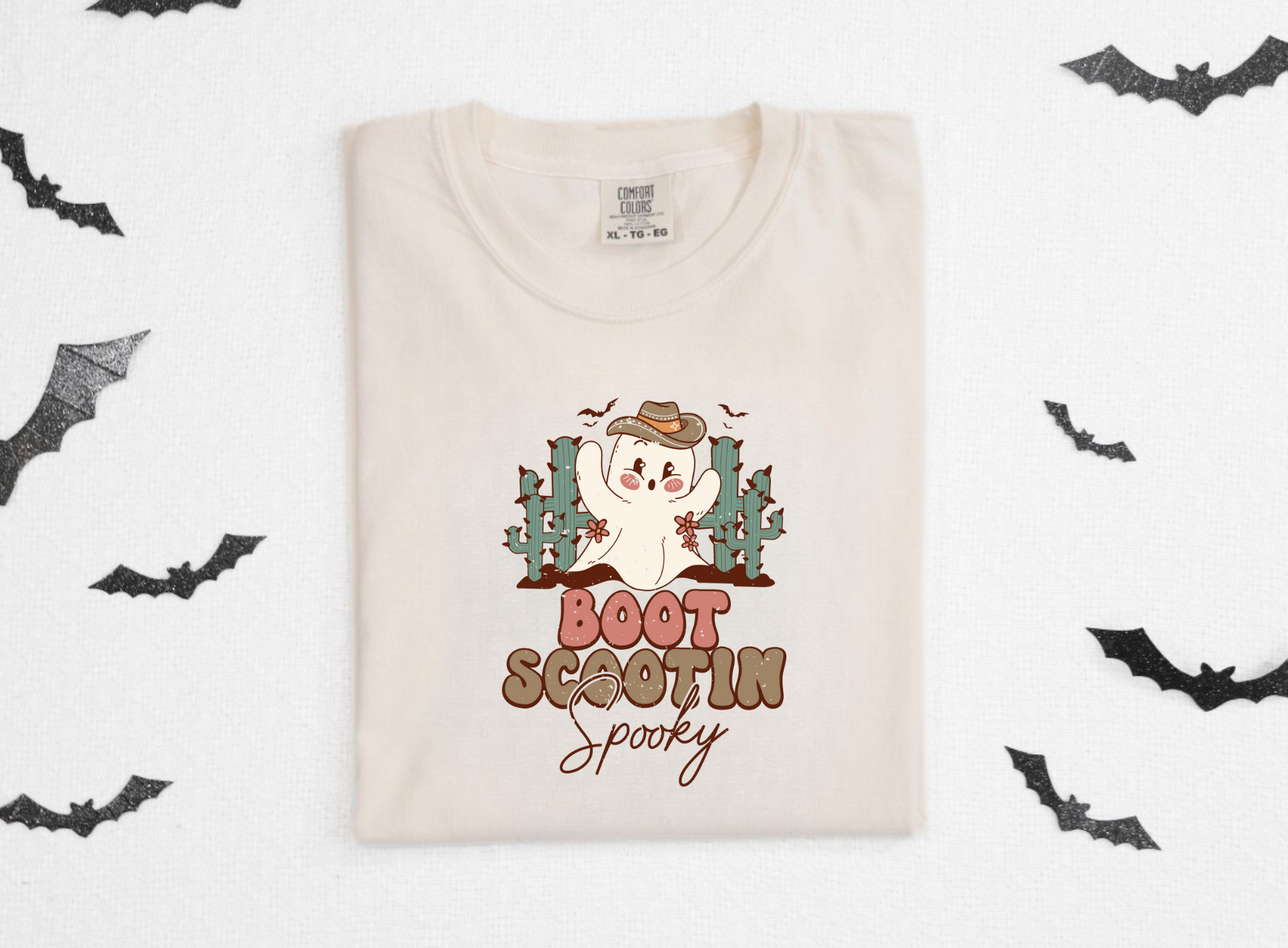 Trendy oversized preppy Western Halloween shirt with "Boot Scootin' Spooky" cowboy design - Embrace the spirit of Western Halloween and autumn with this stylish and playful shirt featuring a ghost cowboy. Perfect blend of retro and trendy fashion for your fall festivities.