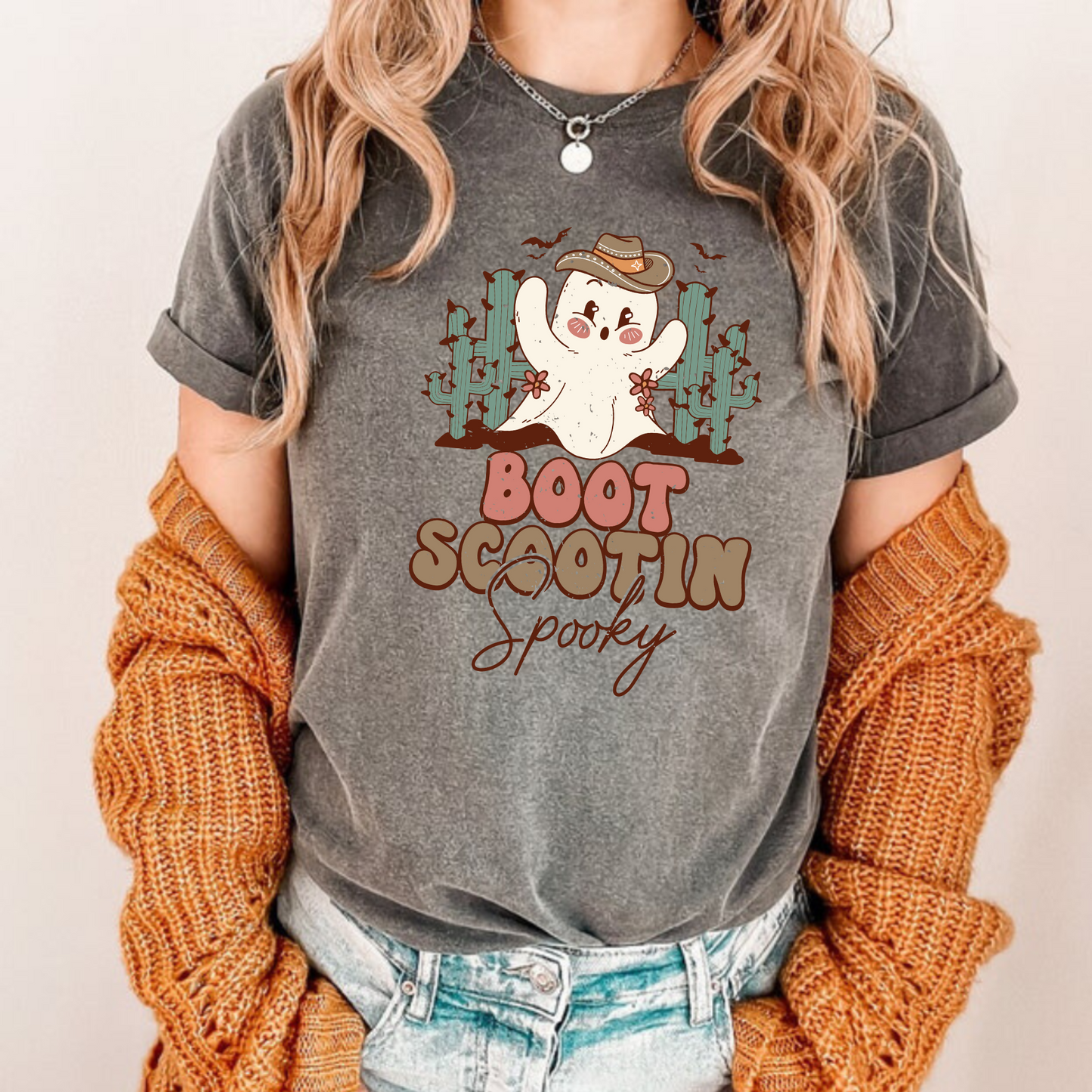 Trendy oversized preppy Western Halloween shirt with "Boot Scootin' Spooky" cowboy design - Embrace the spirit of Western Halloween and autumn with this stylish and playful shirt featuring a ghost cowboy. Perfect blend of retro and trendy fashion for your fall festivities.