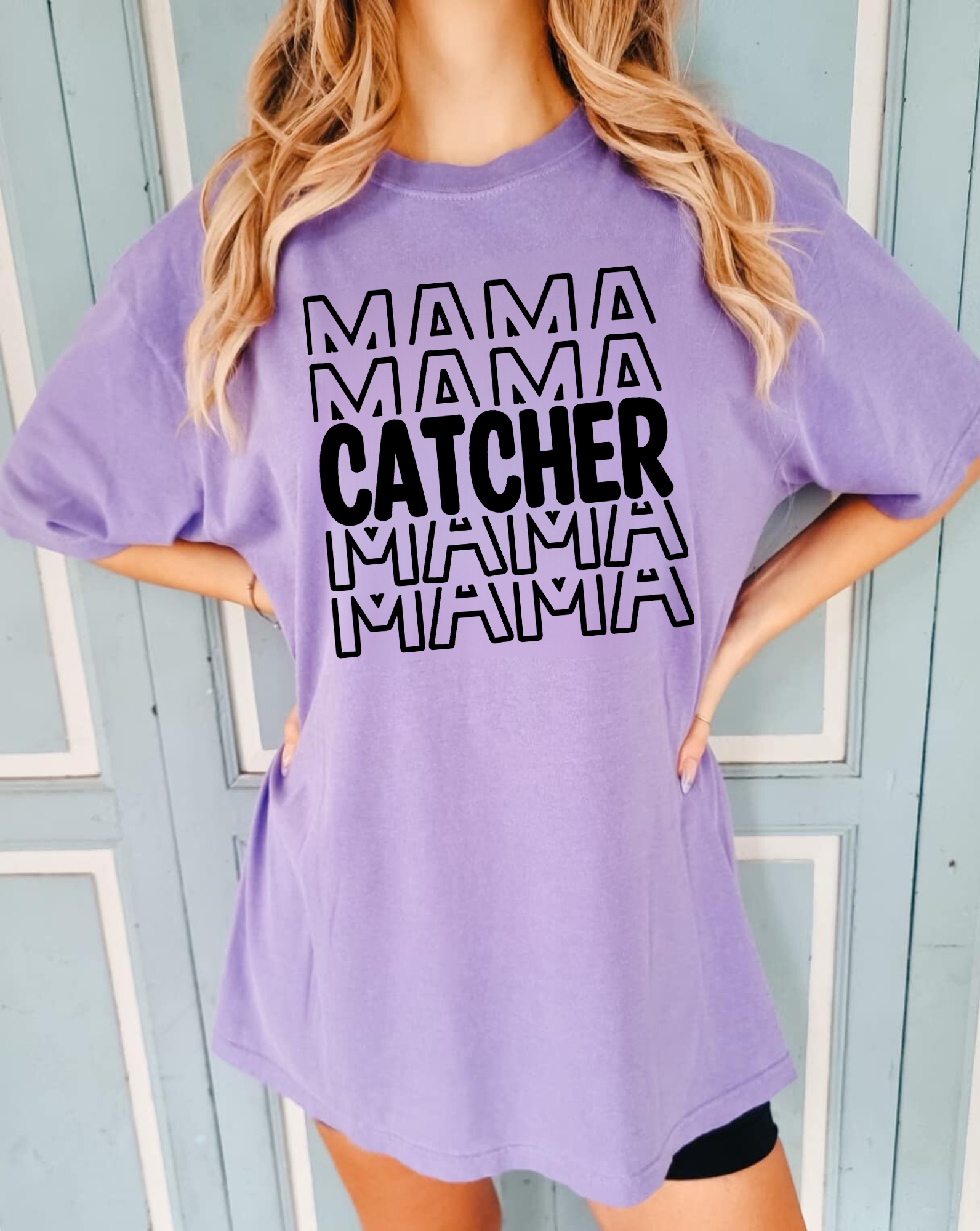 A stylish baseball mom shirt with the text 'Catcher Mama', perfect for game day and showing off your love for baseball. The shirt features a comfortable fit and is a great choice for a mom outfit at the baseball game.