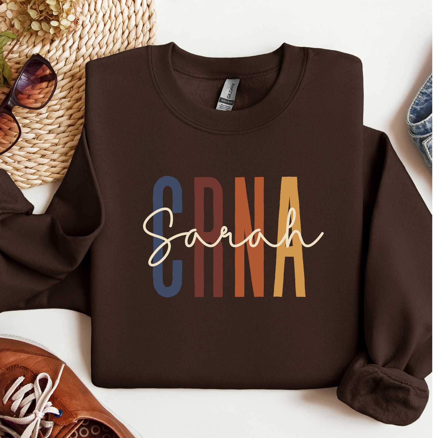 Custom CRNA sweatshirt with personalized name printed on a cozy crewneck, designed for certified registered nurse anesthetists, hospital wear, off-duty comfort, and a thoughtful medical professional gift