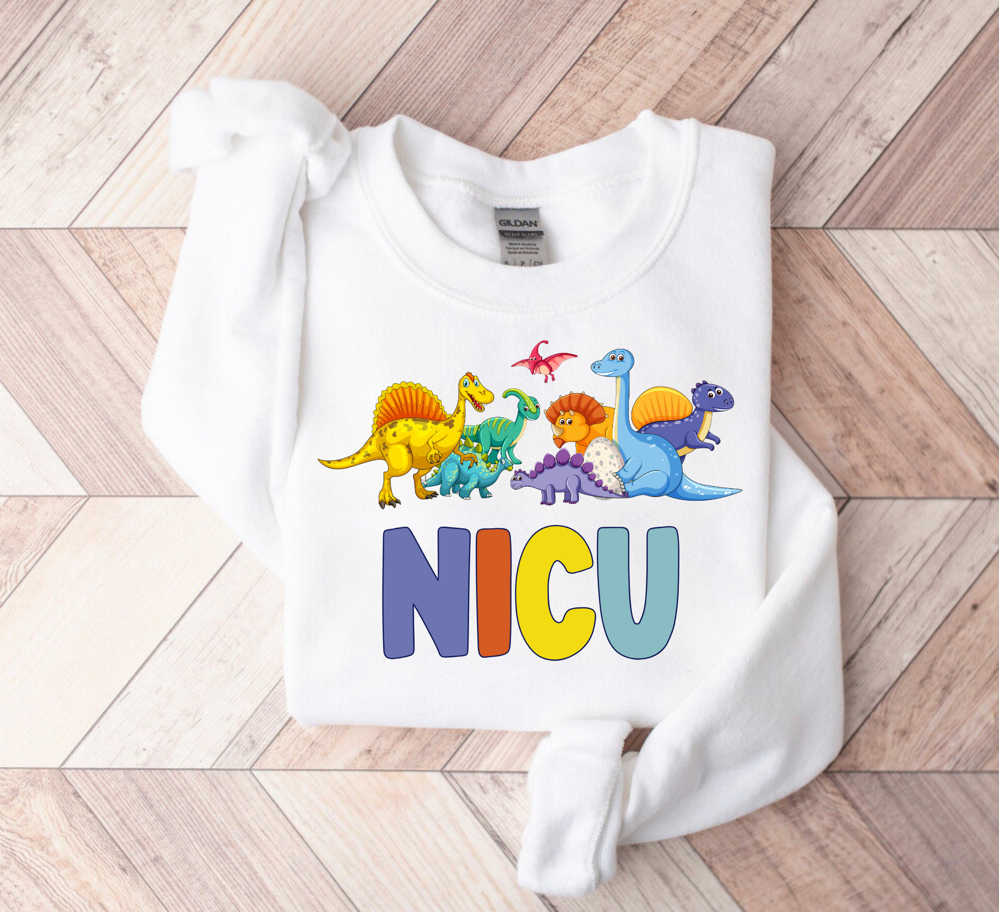 Cute dinosaur NICU nurse sweatshirt featuring an adorable dinosaur design on a cozy crewneck, perfect for neonatal nurses, hospital shifts, off-duty comfort, and a thoughtful nurse gift