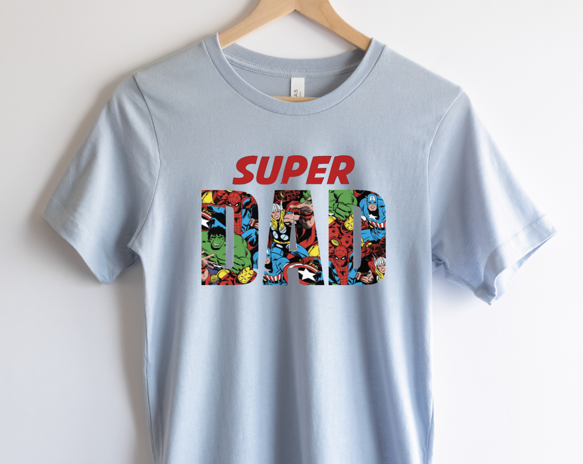 "Super Dad" superhero shirt for Father's Day with a bold design featuring the text "Super Dad" in vibrant colors and superhero icons.