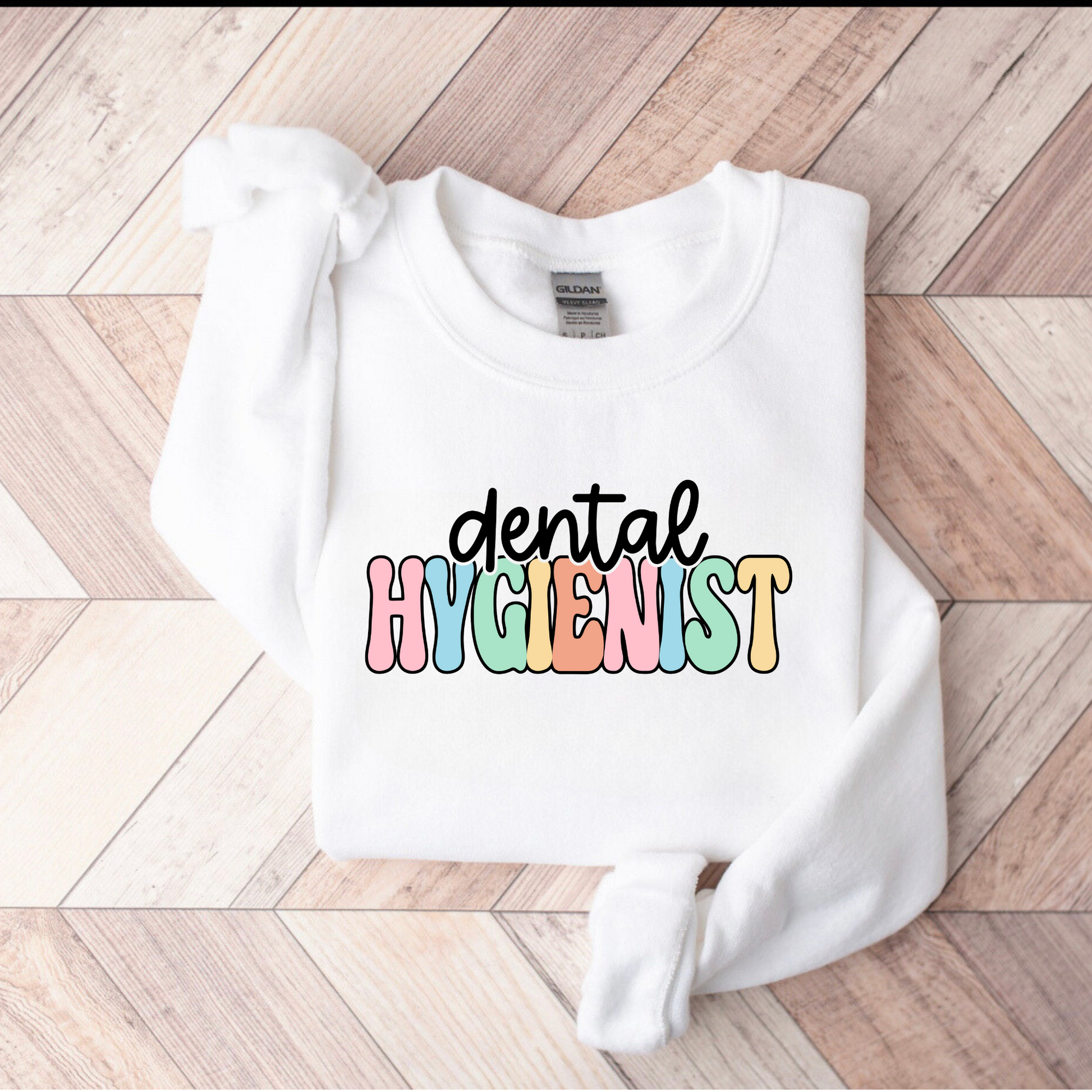 A professional dental hygienist crewneck sweatshirt. This cozy and stylish sweatshirt is perfect for registered dental hygienists, showcasing their pride in their profession. Shop now and add this professional crewneck sweatshirt to your dental hygienist wardrobe.