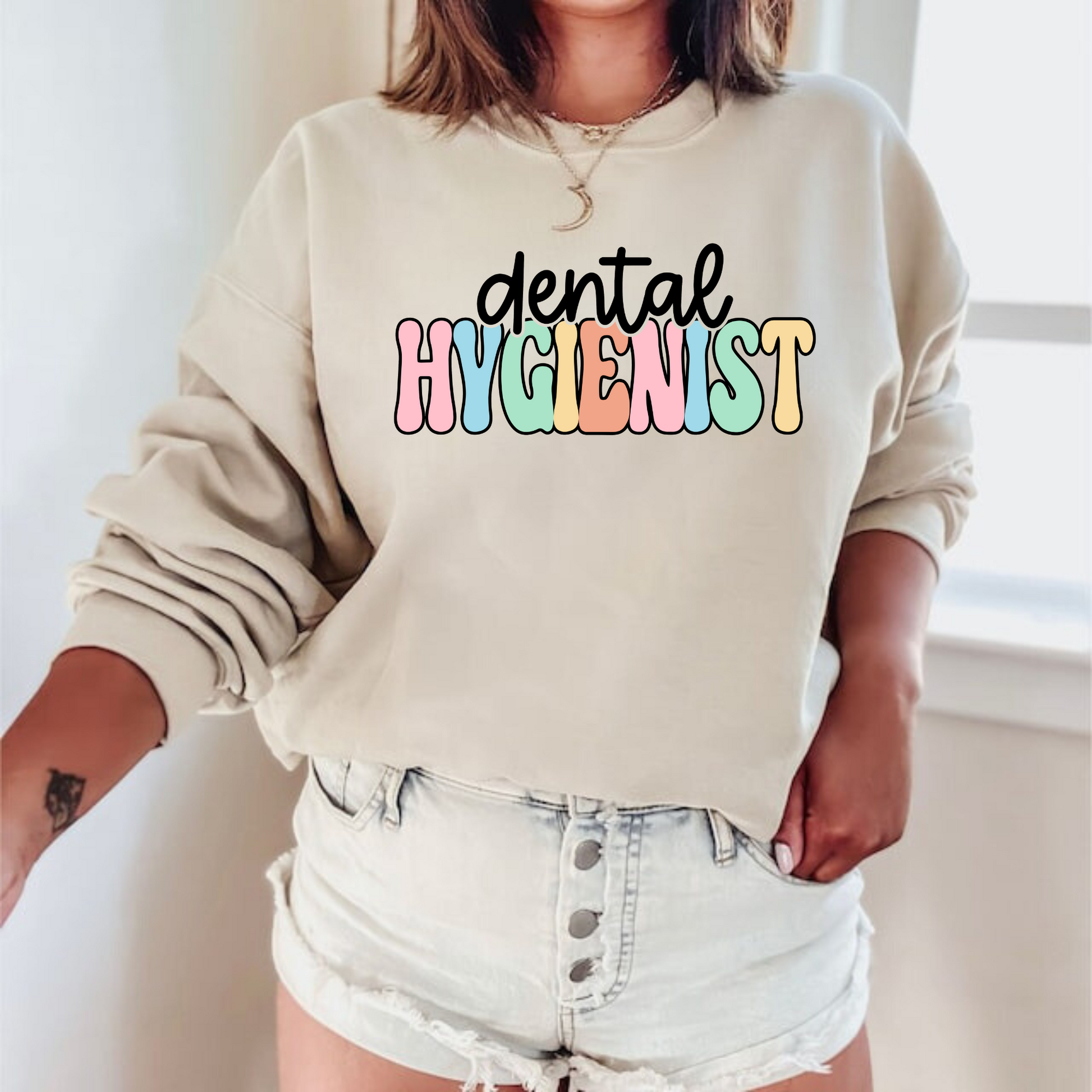 A professional dental hygienist crewneck sweatshirt. This cozy and stylish sweatshirt is perfect for registered dental hygienists, showcasing their pride in their profession. Shop now and add this professional crewneck sweatshirt to your dental hygienist wardrobe.
