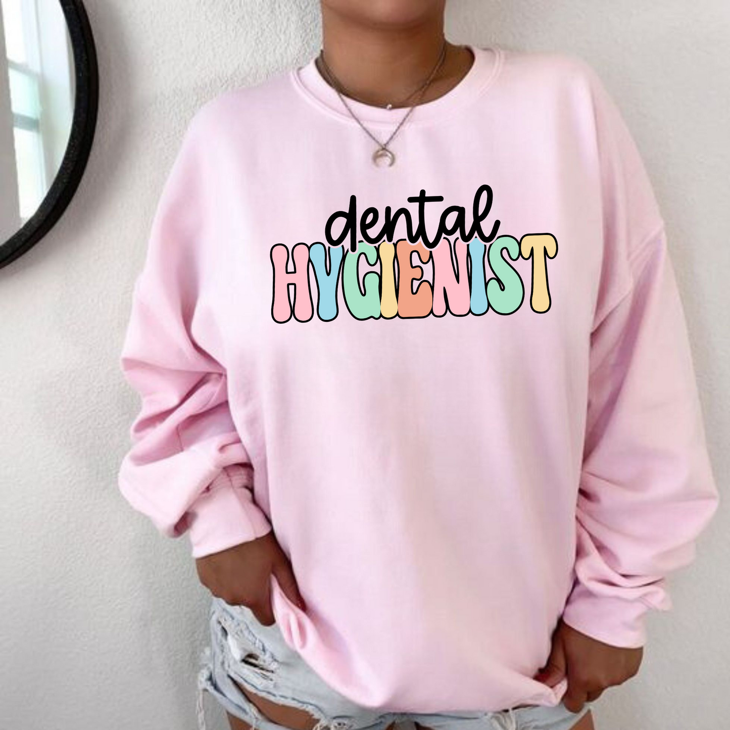A professional dental hygienist crewneck sweatshirt. This cozy and stylish sweatshirt is perfect for registered dental hygienists, showcasing their pride in their profession. Shop now and add this professional crewneck sweatshirt to your dental hygienist wardrobe.