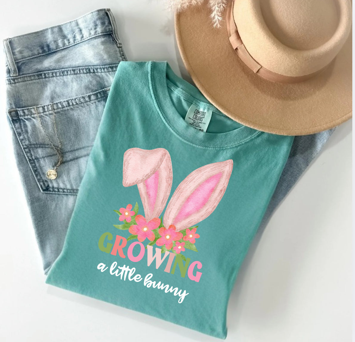 Easter pregnancy announcement shirt saying I’m growing a little bunny on soft Comfort Colors pastel tee