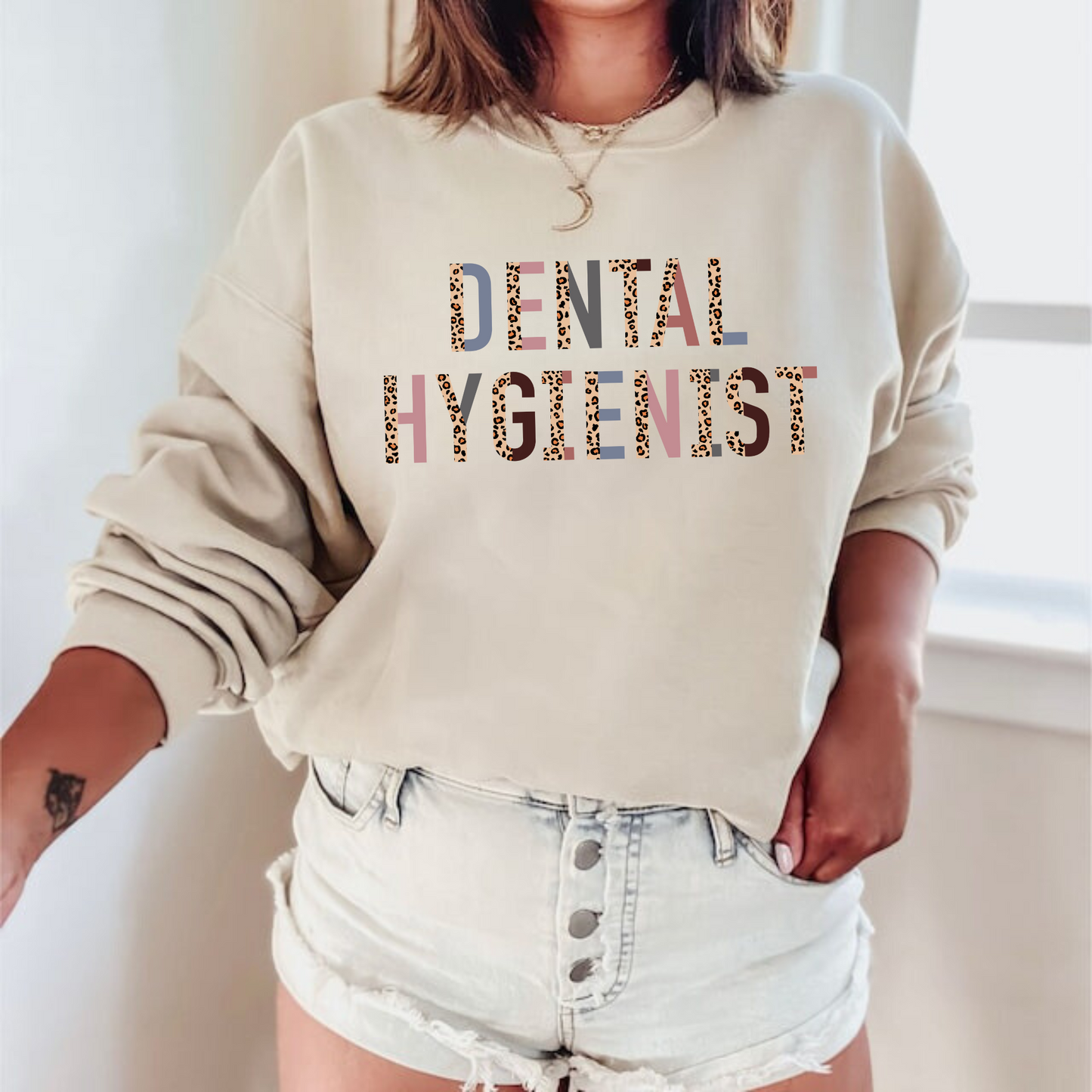 A professional dental hygienist crewneck sweatshirt. This cozy and stylish sweatshirt is perfect for registered dental hygienists, showcasing their pride in their profession. Shop now and add this professional crewneck sweatshirt to your dental hygienist wardrobe.