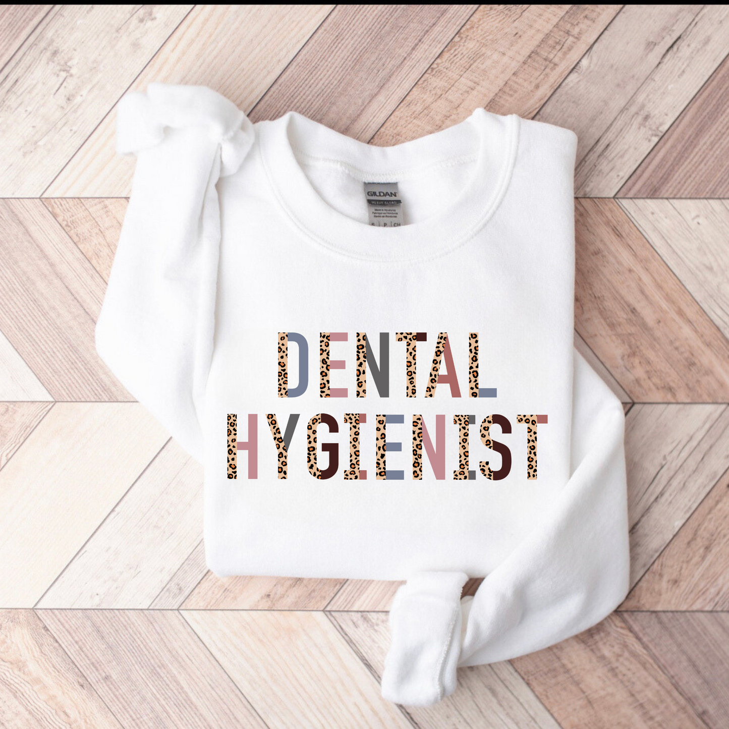 A professional dental hygienist crewneck sweatshirt. This cozy and stylish sweatshirt is perfect for registered dental hygienists, showcasing their pride in their profession. Shop now and add this professional crewneck sweatshirt to your dental hygienist wardrobe.