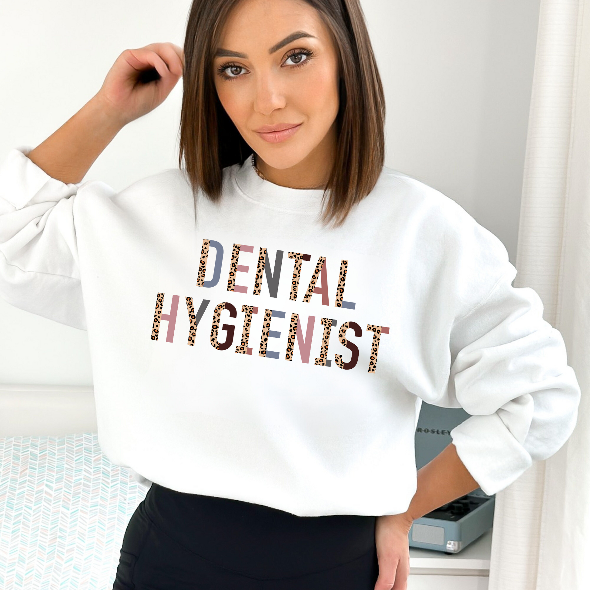 A professional dental hygienist crewneck sweatshirt. This cozy and stylish sweatshirt is perfect for registered dental hygienists, showcasing their pride in their profession. Shop now and add this professional crewneck sweatshirt to your dental hygienist wardrobe.