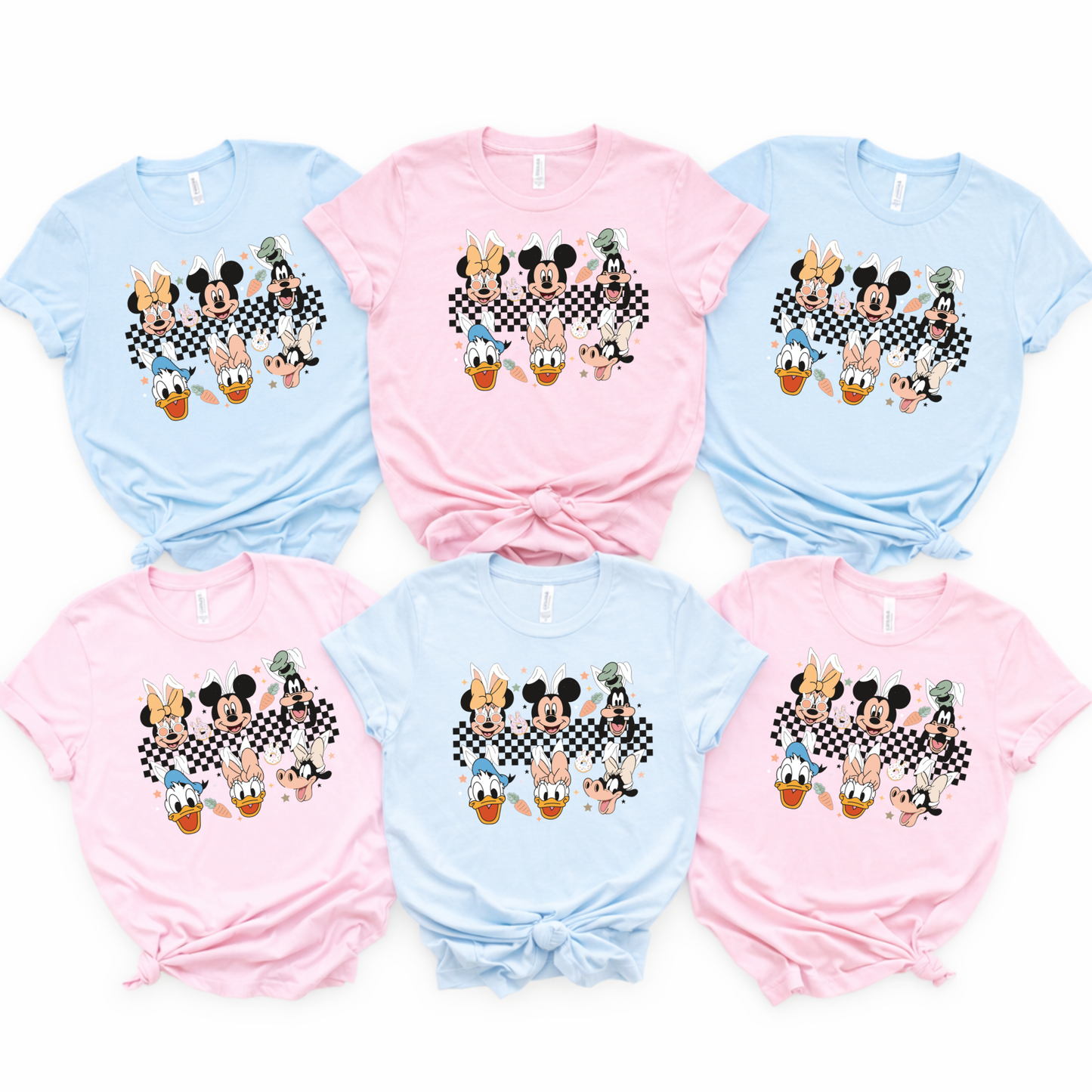 matching family Easter shirts in pastel blue and pink laid flat for spring park vacation outfits