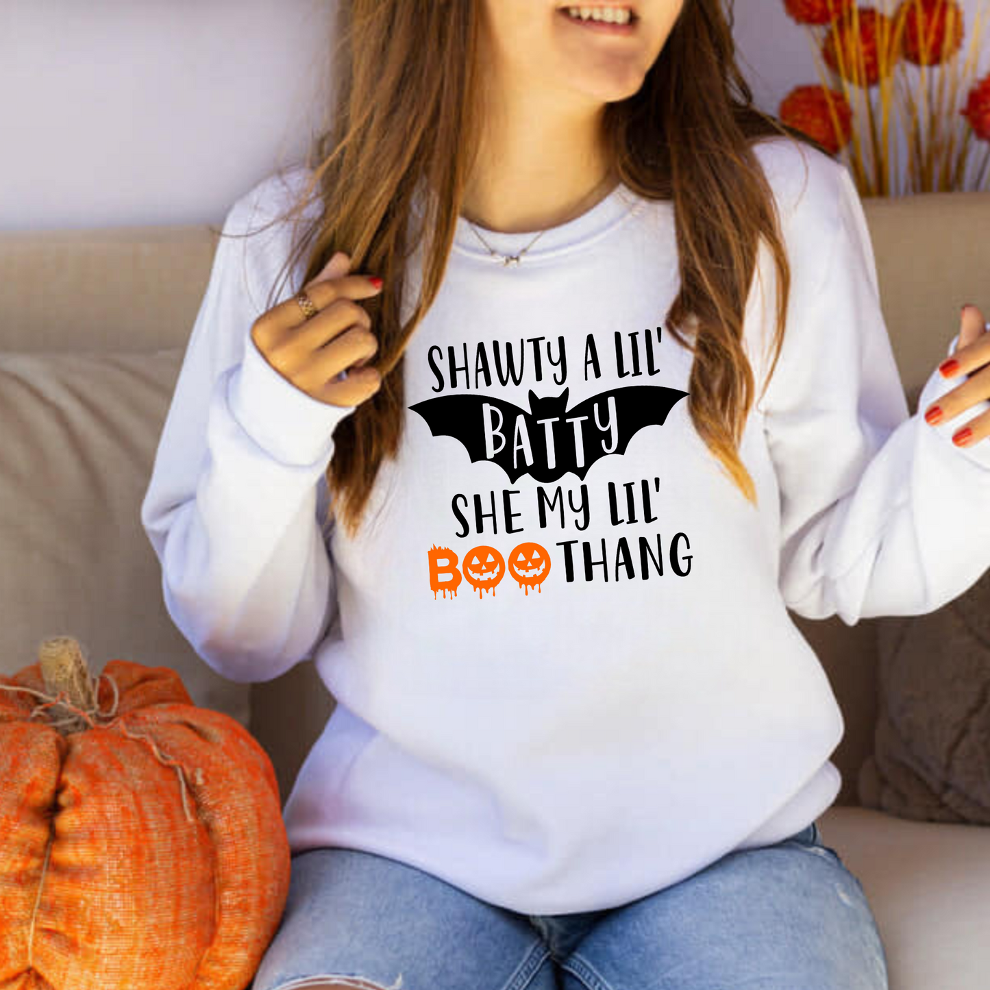 Funny Halloween crewneck sweatshirt with "Shawty a lil batty she my lil boo thang" design - Embrace the cozy and humorous side of fall fashion with this crewneck sweatshirt. Perfect for adding some laughter to your autumn outfits during the spooky season.