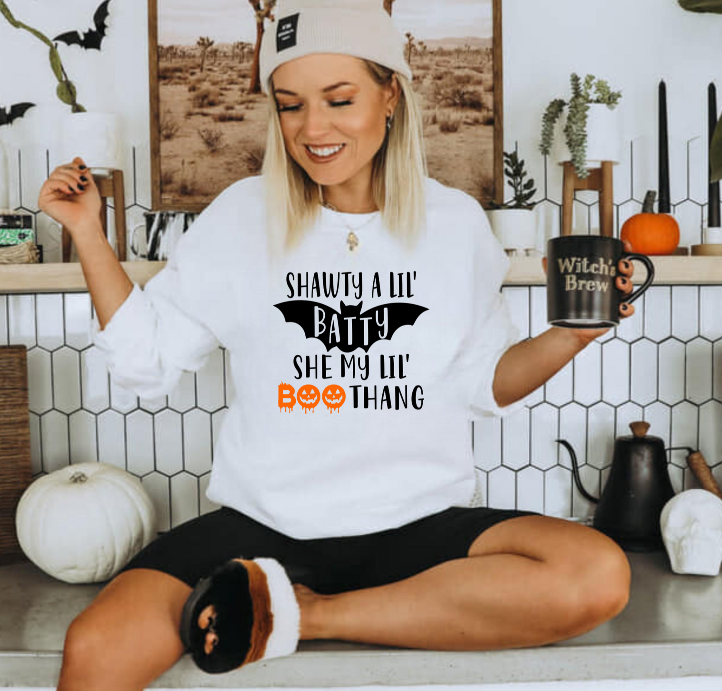Funny Halloween crewneck sweatshirt with "Shawty a lil batty she my lil boo thang" design - Embrace the cozy and humorous side of fall fashion with this crewneck sweatshirt. Perfect for adding some laughter to your autumn outfits during the spooky season.
