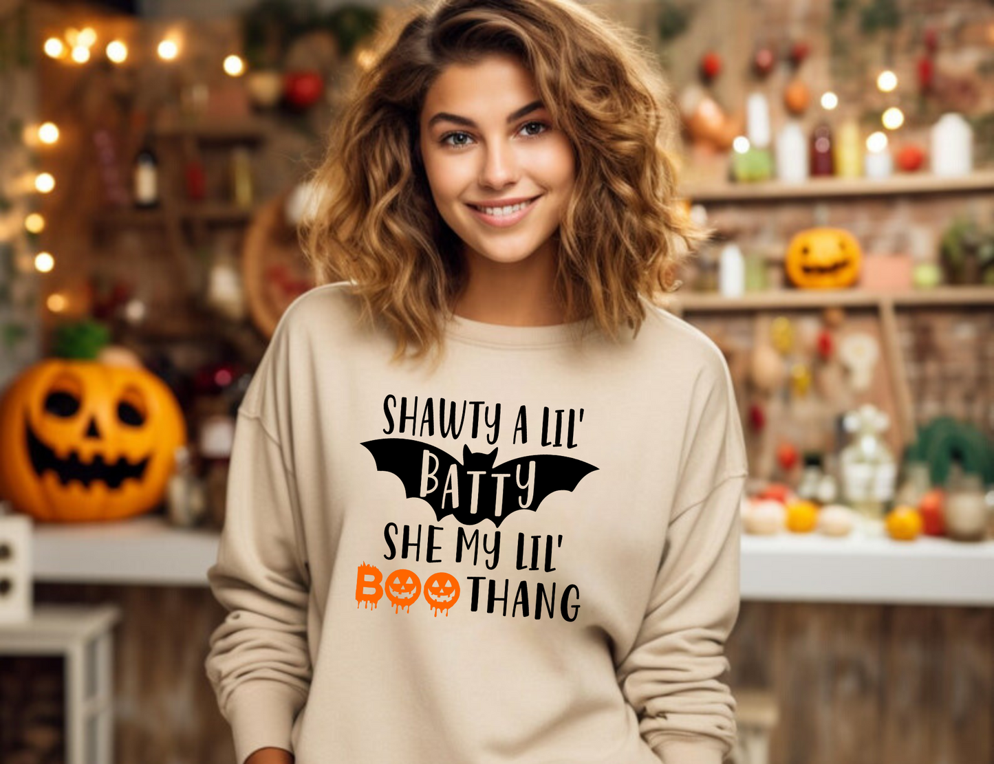 Funny Halloween crewneck sweatshirt with "Shawty a lil batty she my lil boo thang" design - Embrace the cozy and humorous side of fall fashion with this crewneck sweatshirt. Perfect for adding some laughter to your autumn outfits during the spooky season.
