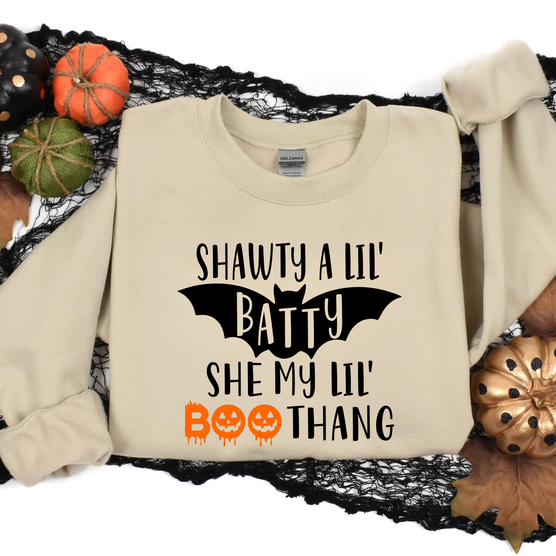 Funny Halloween crewneck sweatshirt with "Shawty a lil batty she my lil boo thang" design - Embrace the cozy and humorous side of fall fashion with this crewneck sweatshirt. Perfect for adding some laughter to your autumn outfits during the spooky season.
