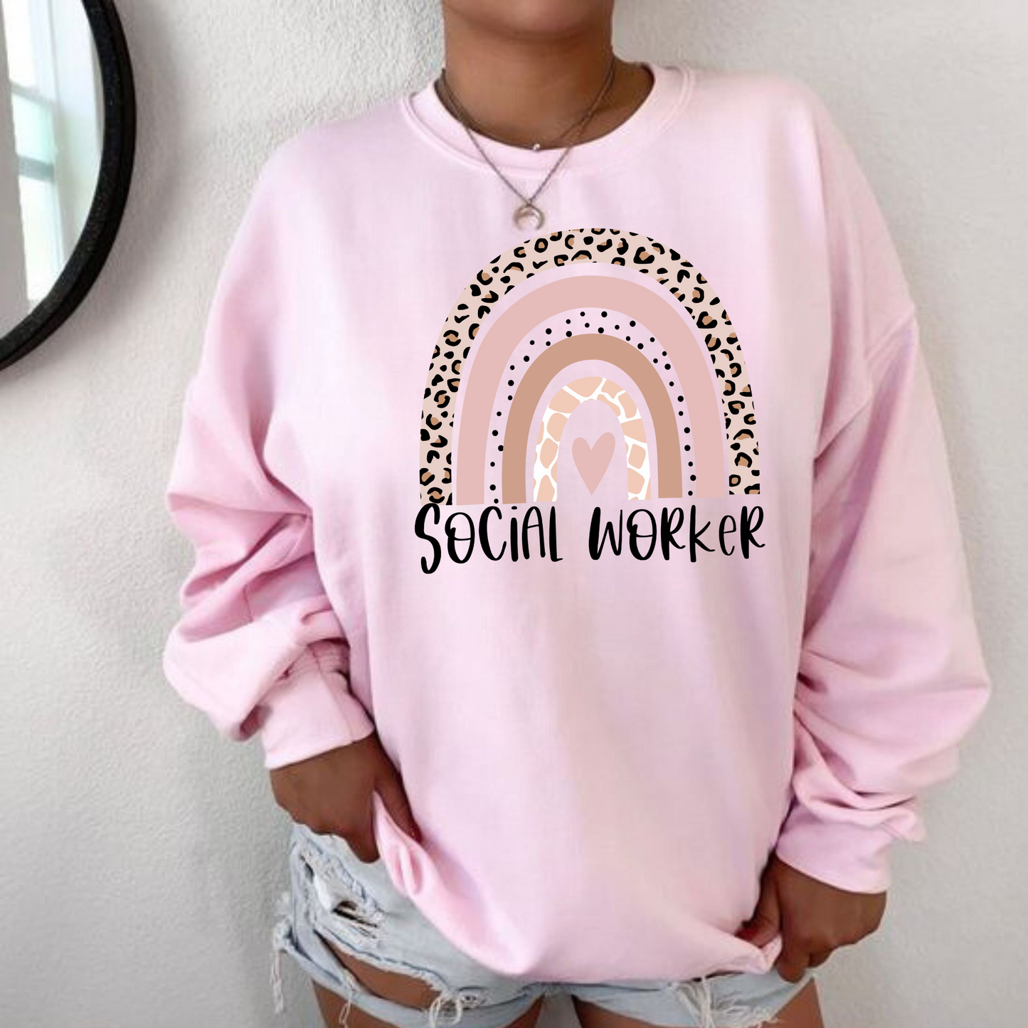 A boho rainbow social worker crewneck sweatshirt. This cozy sweatshirt is perfect for social workers and MSW graduates, featuring a vibrant boho rainbow design. Shop now and showcase your dedication to the field of social work with this stylish crewneck sweatshirt.