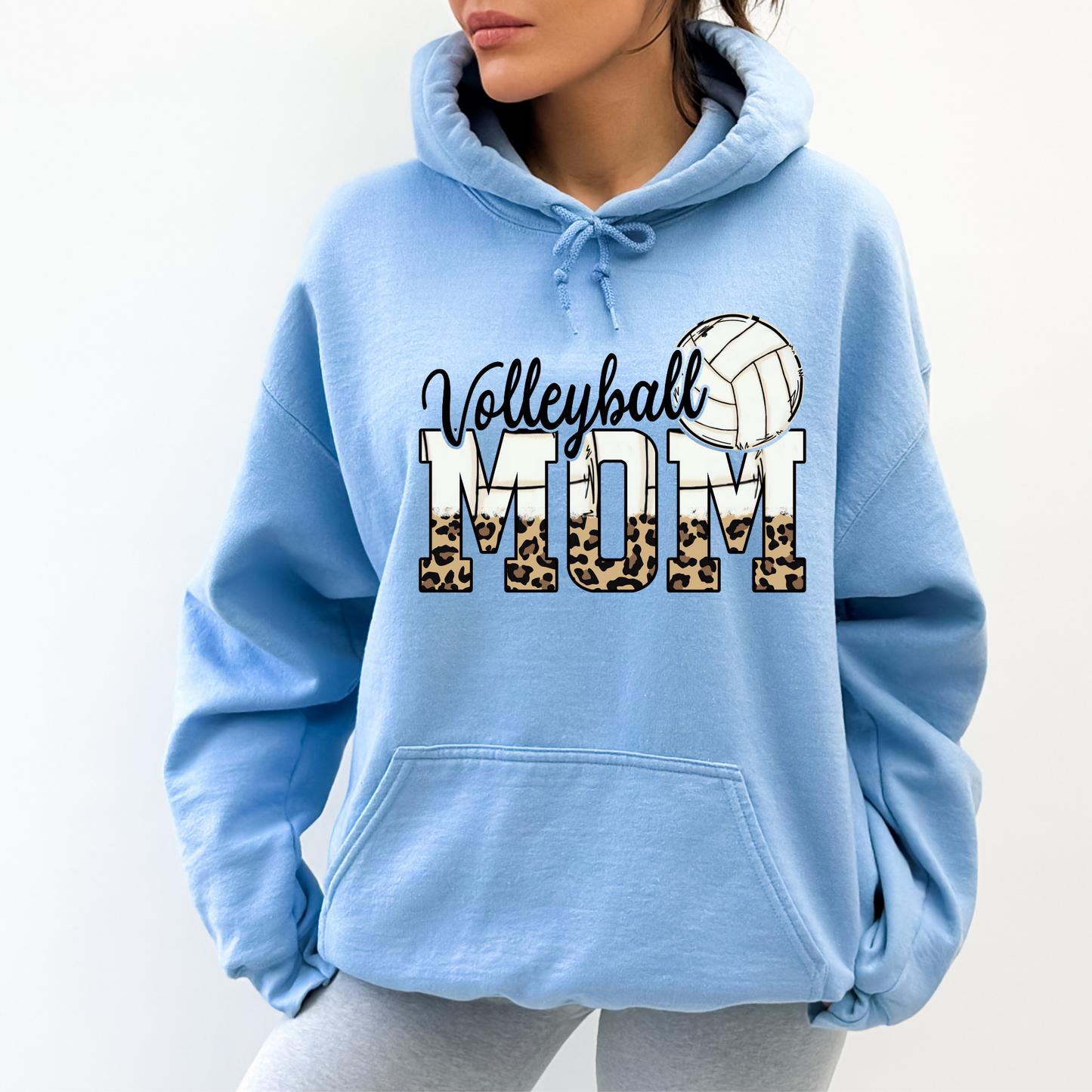 Cozy volleyball mom hoodie sweatshirt - Show your support in comfort with this essential hoodie perfect for volleyball games. Stay cozy and stylish as a proud volleyball mama.