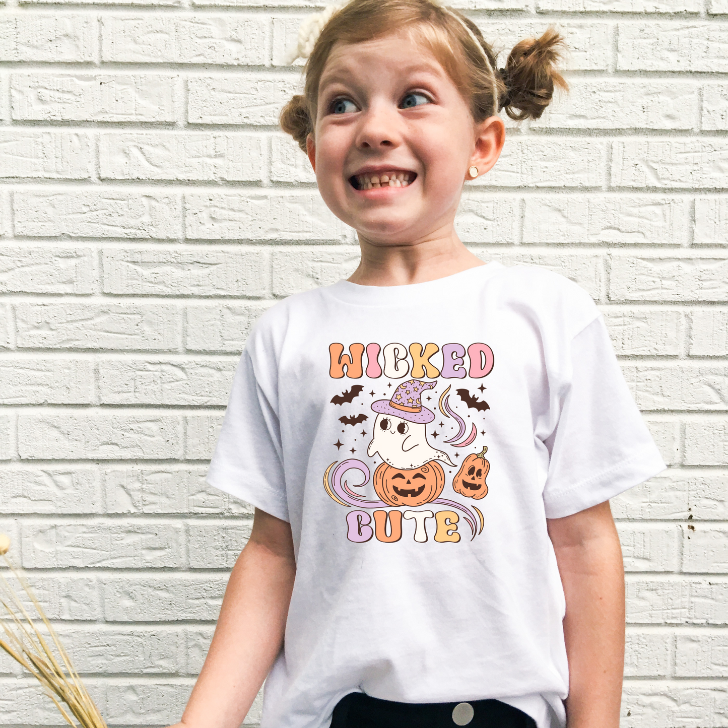 'Wicked Cute' Halloween Shirt for Girls - Elevate her Halloween charm with our playful and preppy Halloween shirt, celebrating the season in adorable style. Perfect for adding a unique touch to her Halloween outfit. Shop now for the personalized kids' Halloween shirt!